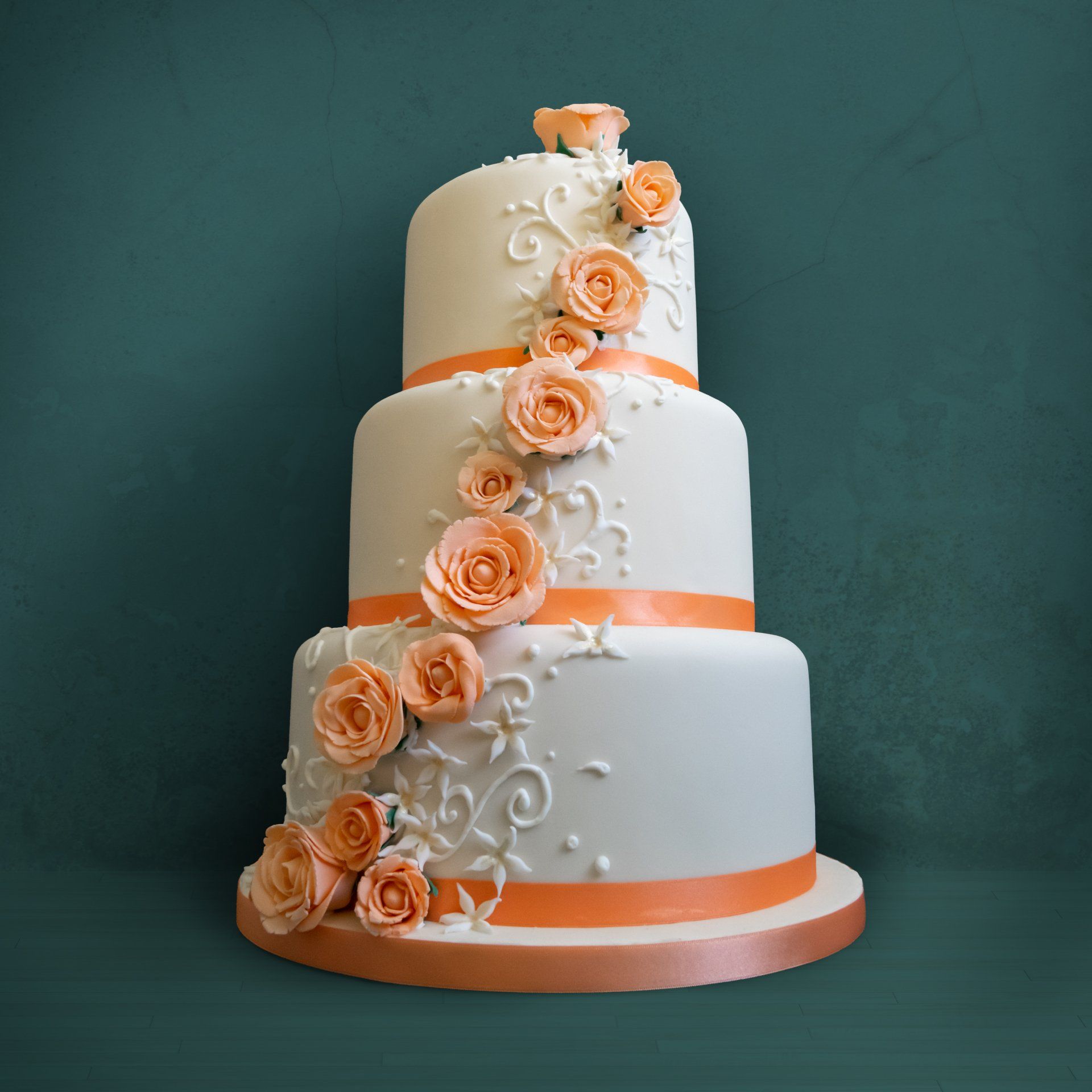 Large peach and blue tiered wedding cake  from A Cherry On Top bakery on the Isle of Wight, photography by MooksGoo