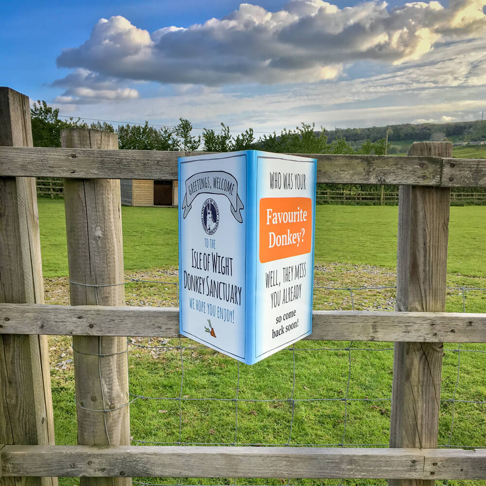 Quirky folded fence signage for the Isle of Wight Donkey Sanctuary, designed by MooksGoo