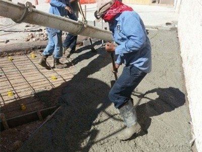 Workers Fixing and Pouring Concrete — Mercedes, TX — Bernal Paving Workers Fixing and Pouring Concrete — Mercedes, TX — Bernal Paving