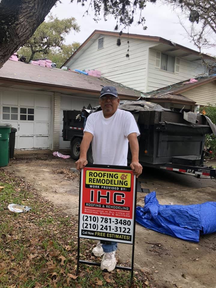 Man with Signage — San Antonio, TX — IHC Roofing