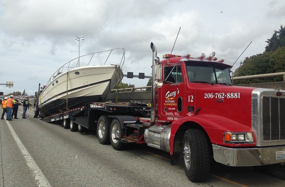Truck Towing a Yacht — Seattle, WA — Gary's Westside Towing