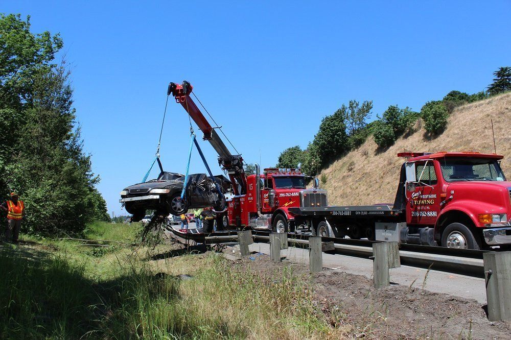 Lifting Damaged Car — Seattle, WA — Gary's Westside Towing