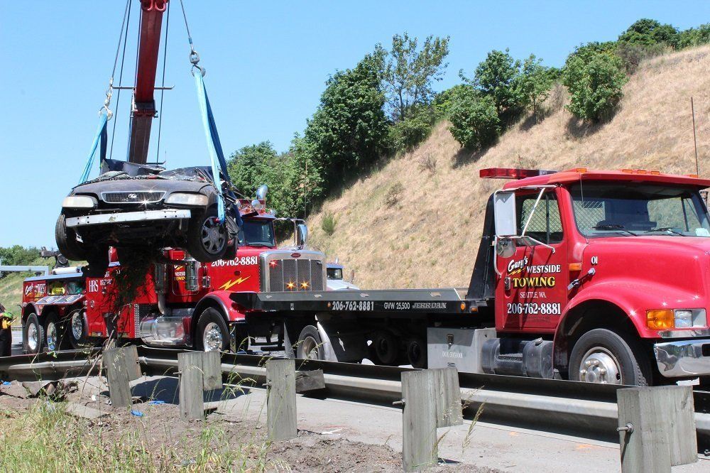 Putting Damaged Car on the Truck — Seattle, WA — Gary's Westside Towing