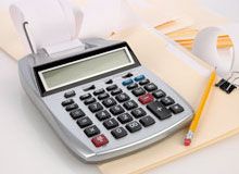 Calculator with pencil on paperwork
