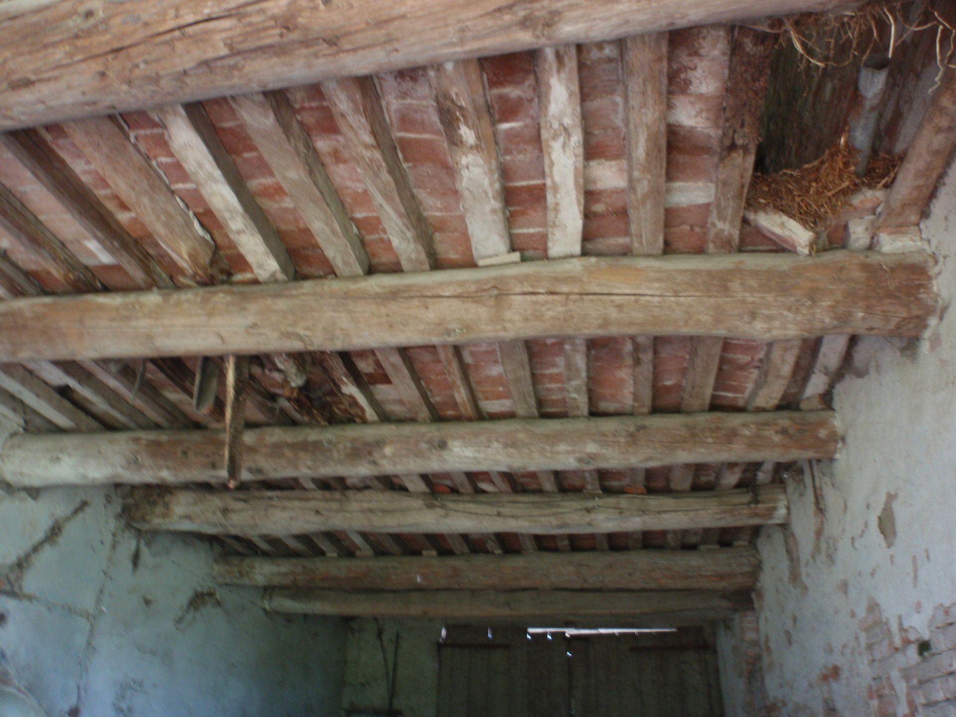 Degradation of the joists and collapse of the slabs of the attic.