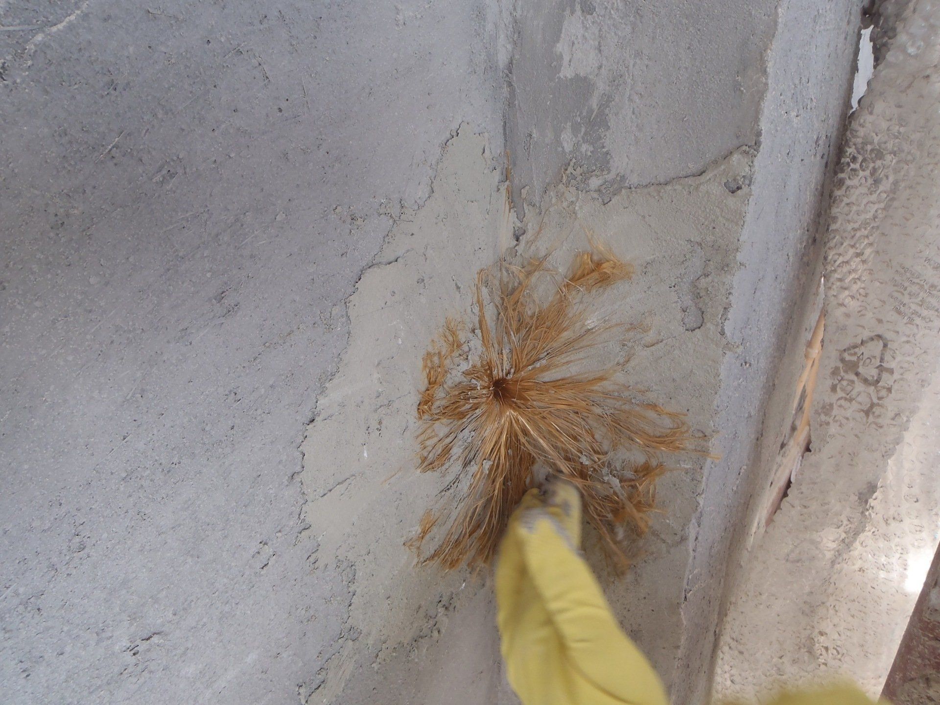 masonry consolidation: insertion of Ruregold XJoint connectors for connecting the reinforcement mesh to the masonry