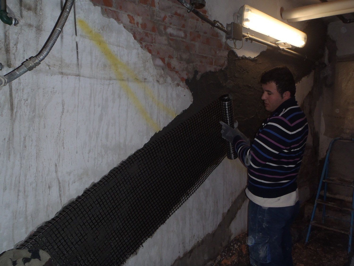 wall reinforcement with PBO fiber laying system FRCM