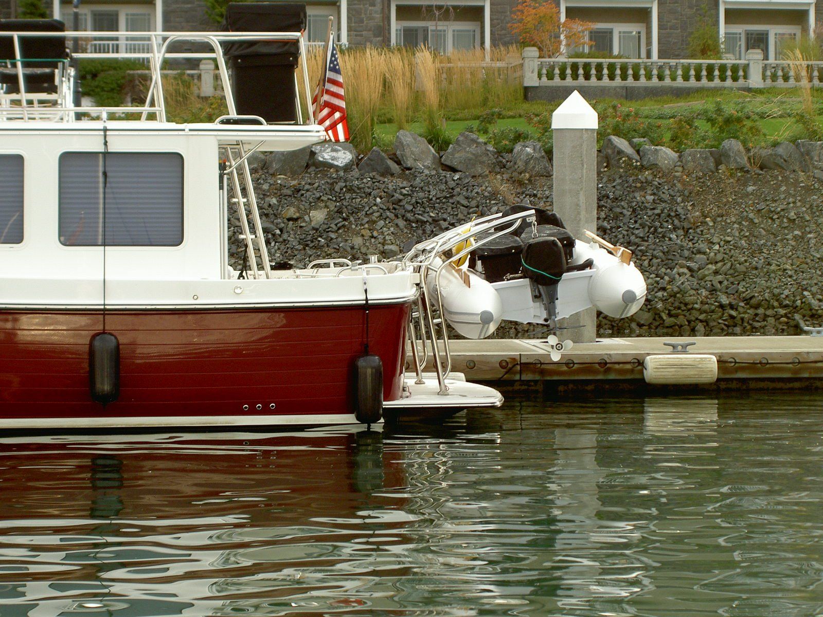 Stainless steel davit system by Tanner Manufacturing installed on a swim platform. 