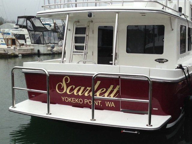 A boat with two staple rails with crossmembers installed on the swim platform. 