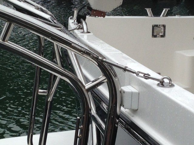 Stainless steel davit system by Tanner Manufacturing installed on a swim platform. 
