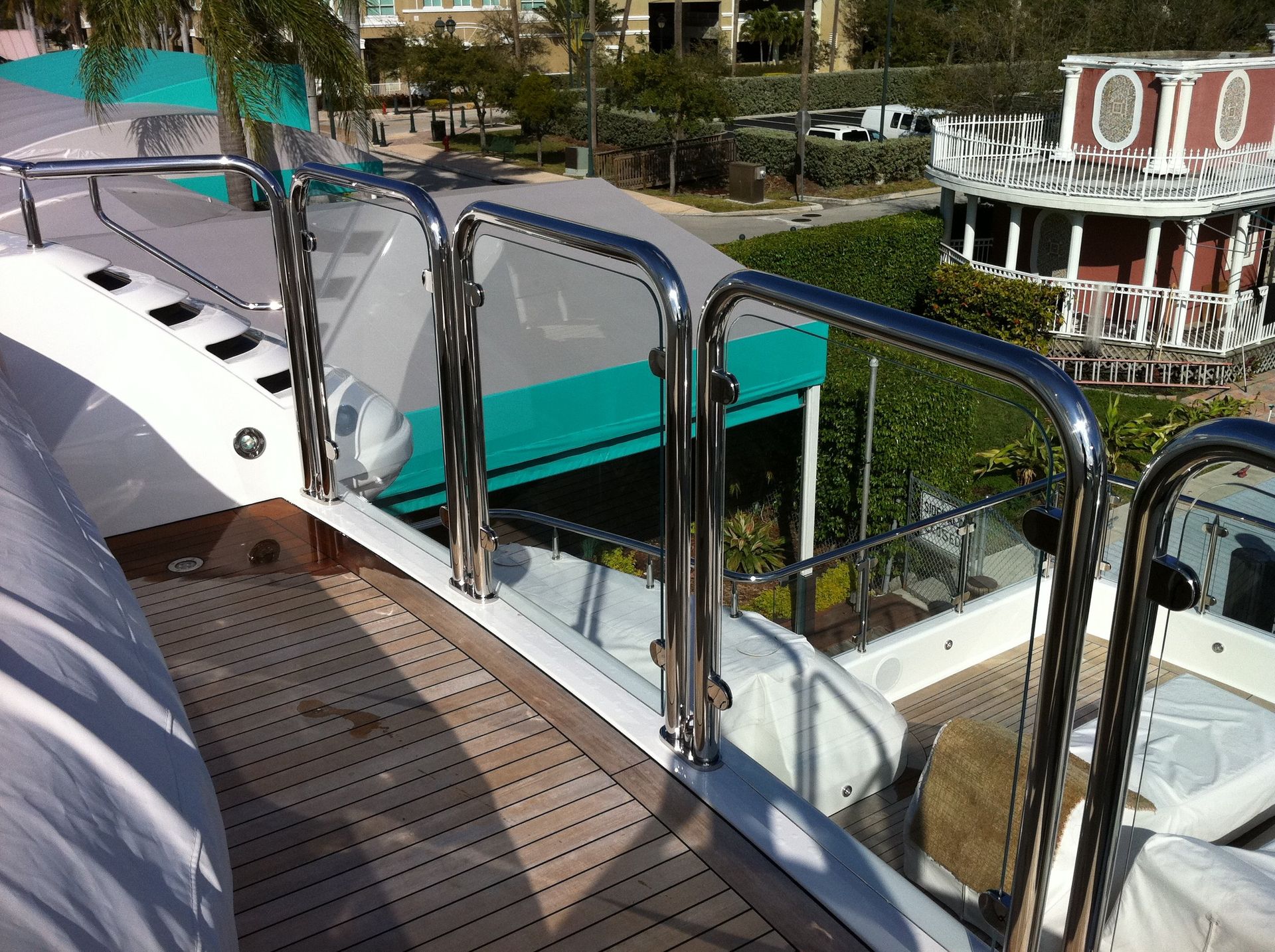 Upper deck staple rails with glass clips by Tanner Manufacturing.