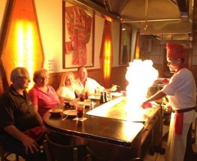 Family Enjoying Hibachi Together — Japanese Restaurant in Wood Dale, IL Family Enjoying Hibachi Together — Japanese Restaurant in Wood Dale, IL
