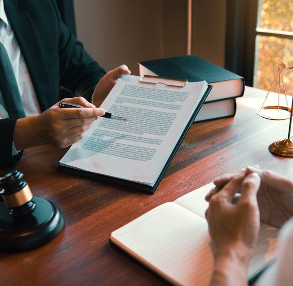 Attorney discussing something to client — Geneva, NY — Bond McDonald and Lehman PC