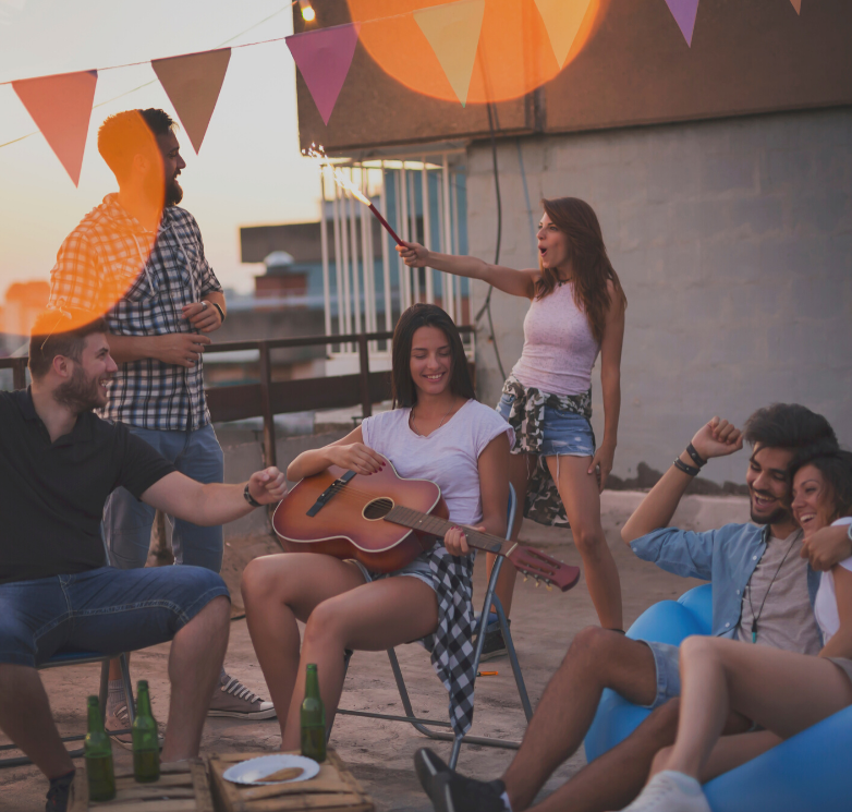 A woman is playing a guitar to a group of people