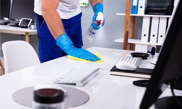Cleaning Faculty Desk — Anderson, SC — CFL Facilities Services Cleaning Faculty Desk — Anderson, SC — CFL Facilities Services