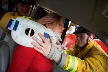 Two Firemen Helping Woman — Attorneys in Fall River, MA Two Firemen Helping Woman — Attorneys in Fall River, MA