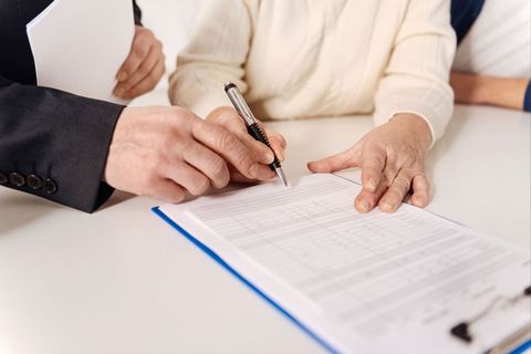 Old Lady Signing A Paper - Law Experience in Cloquet, MN