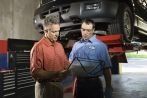 Mechanics working on a car
