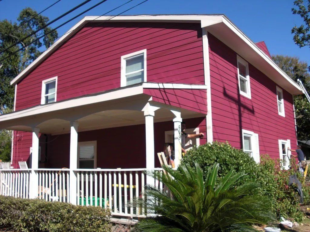 Front of the house being painted after the Hardie siding is installed.