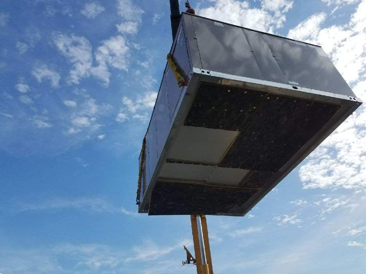 Crane with Container — Cumberland, MD — Growden Heating And Cooling