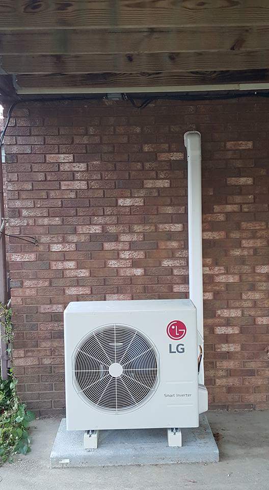 Brick Wall and White Air Condition — Cumberland, MD — Growden Heating And Cooling
