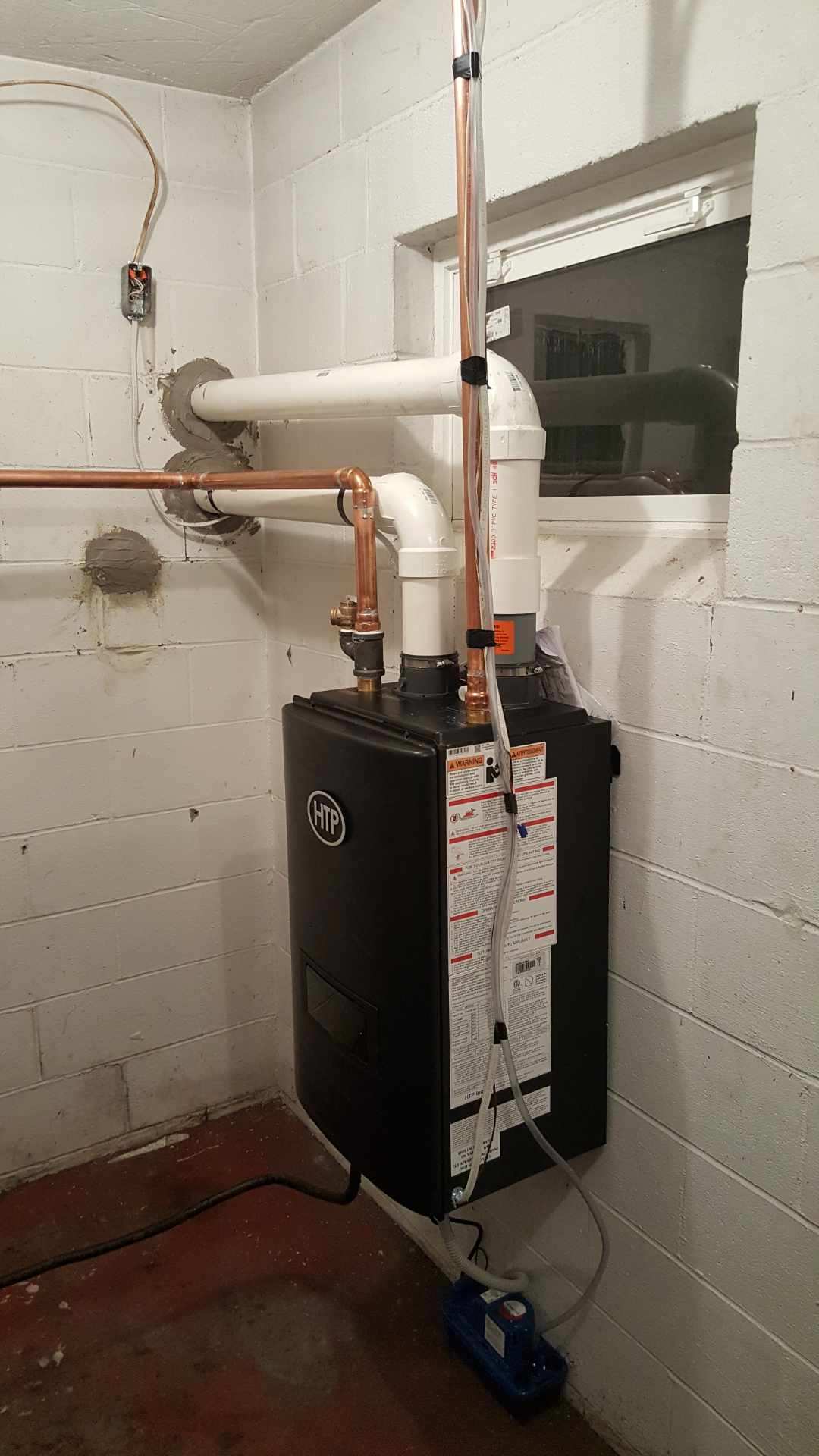 Black Heater with White Wall — Cumberland, MD — Growden Heating And Cooling