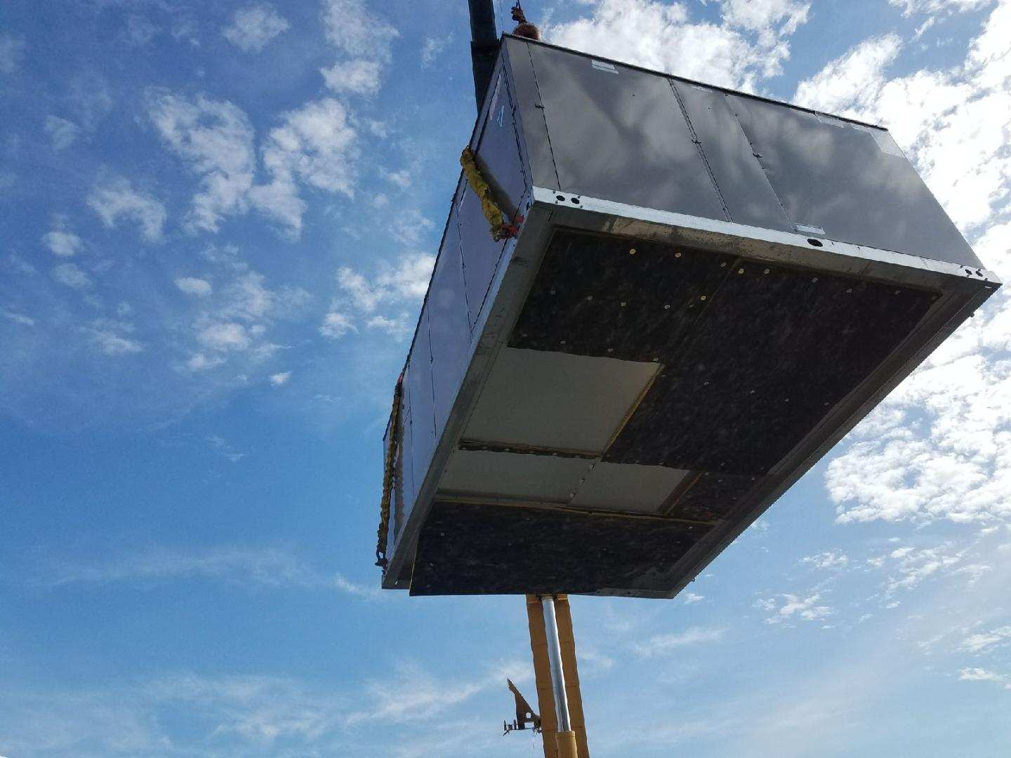 Crane with Container — Cumberland, MD — Growden Heating And Cooling