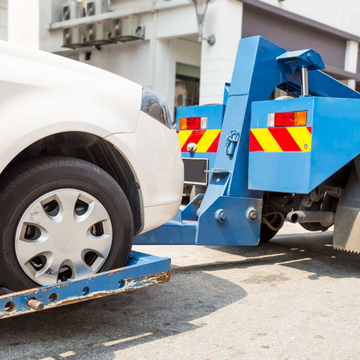 Tow Truck Towing A Car — Belvoir Automotive Salvage in Culpeper, VA