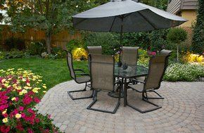 For a new driveway or patio in Rotherham call CS Surfacing Ltd Table and chairs on a patio