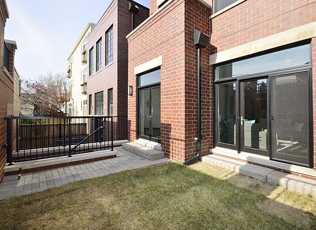 Backyard with fenced-in grass area