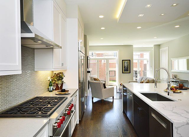 Gourmet kitchen with stainless steel appliances and a large marble kitchen island
