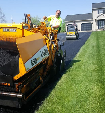 Worker Leveling Fresh Asphalt During Asphalt Pavement Repair — West Manchester, OH — Back 2 Black Asphalt