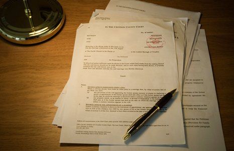 Set of papers on table