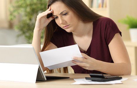 Disappointed lady looking it into papers