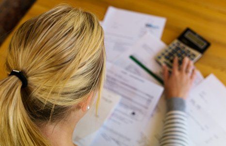 lady checking with calculator