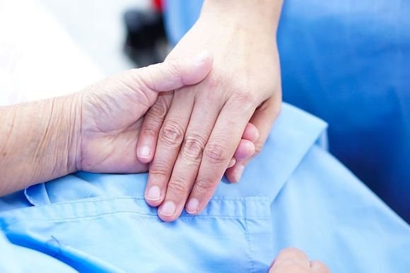 patient holding the hand