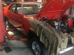 red car being serviced