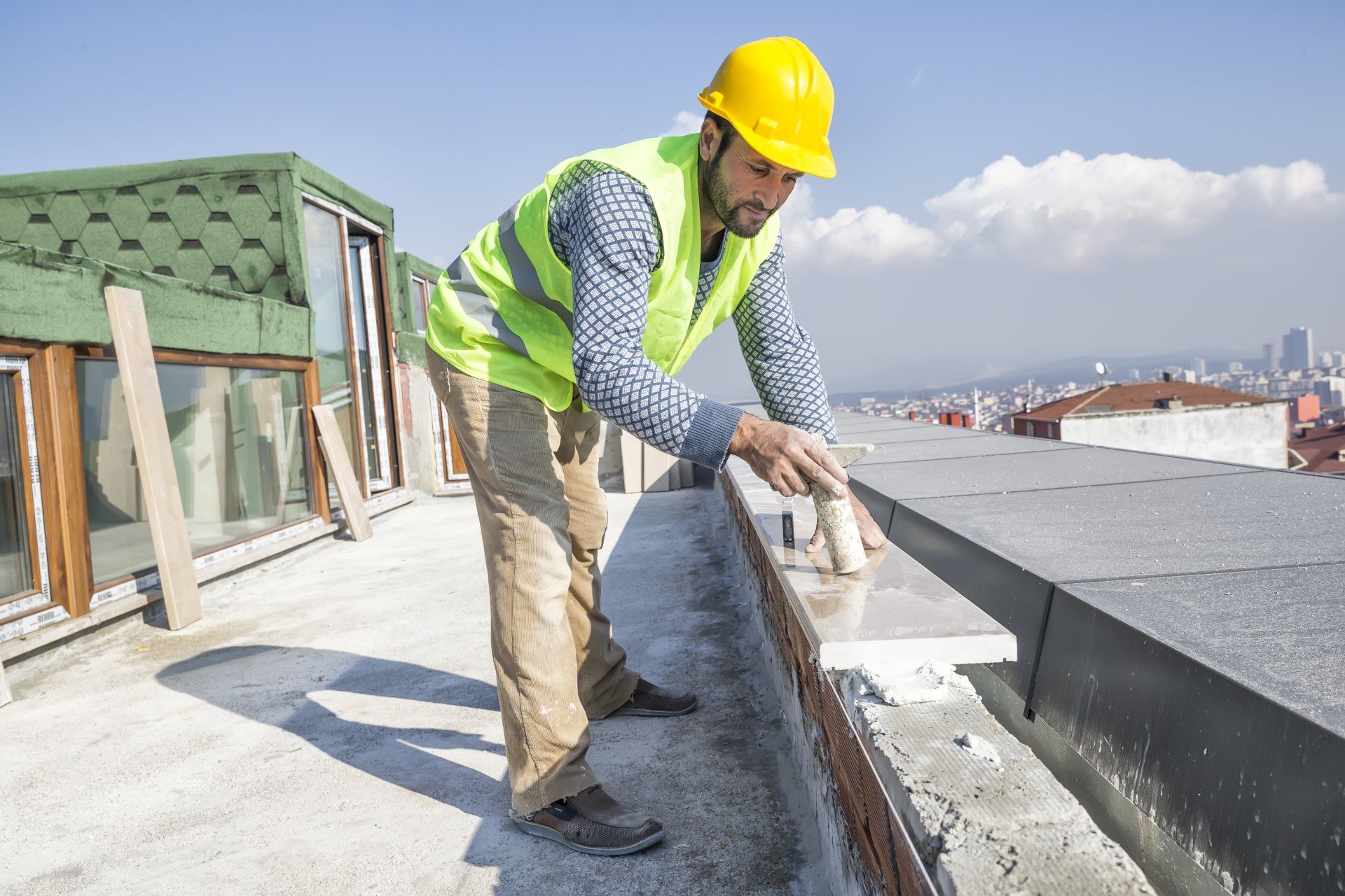 Construction Worker Paving Granite Wall - Stone & Tile Supplier in Golden Square, VIC