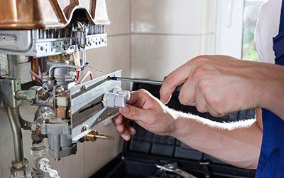 Adjusting gas water heater - Air Conditioning Service in Lebanon, MO Adjusting gas water heater - Air Conditioning Service in Lebanon, MO