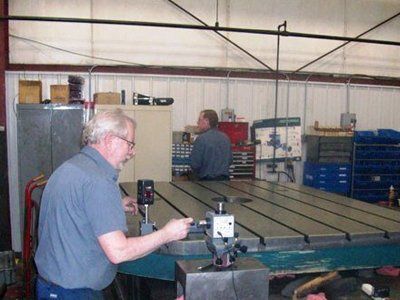 Surface Grinding — Worker Doing Some Calibration In Kaukauna, WI Surface Grinding — Worker Doing Some Calibration In Kaukauna, WI