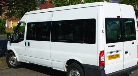A white Mini Bus