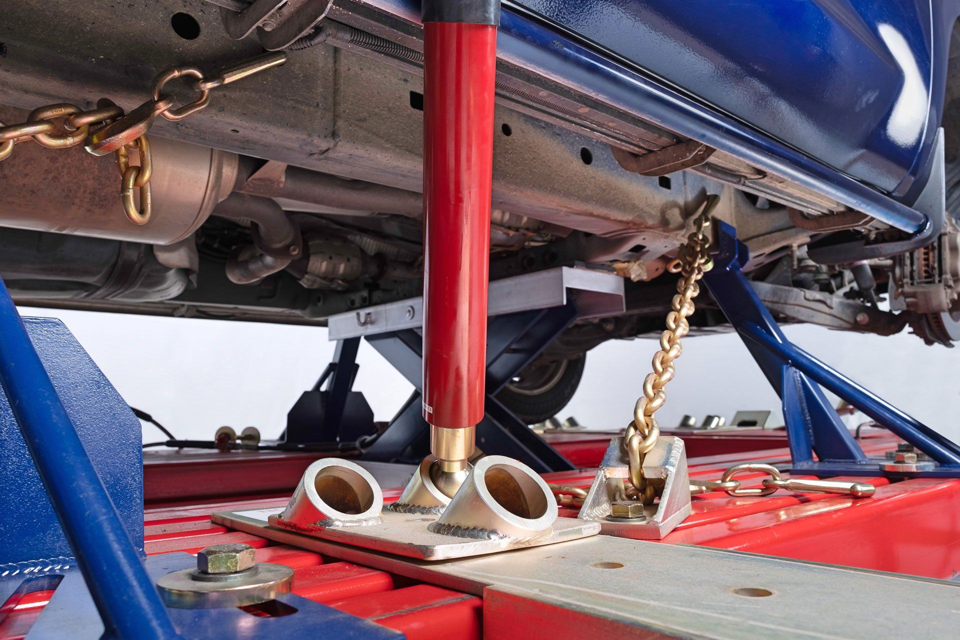 Car locked on automobile frame lift with anchor blocks for sale