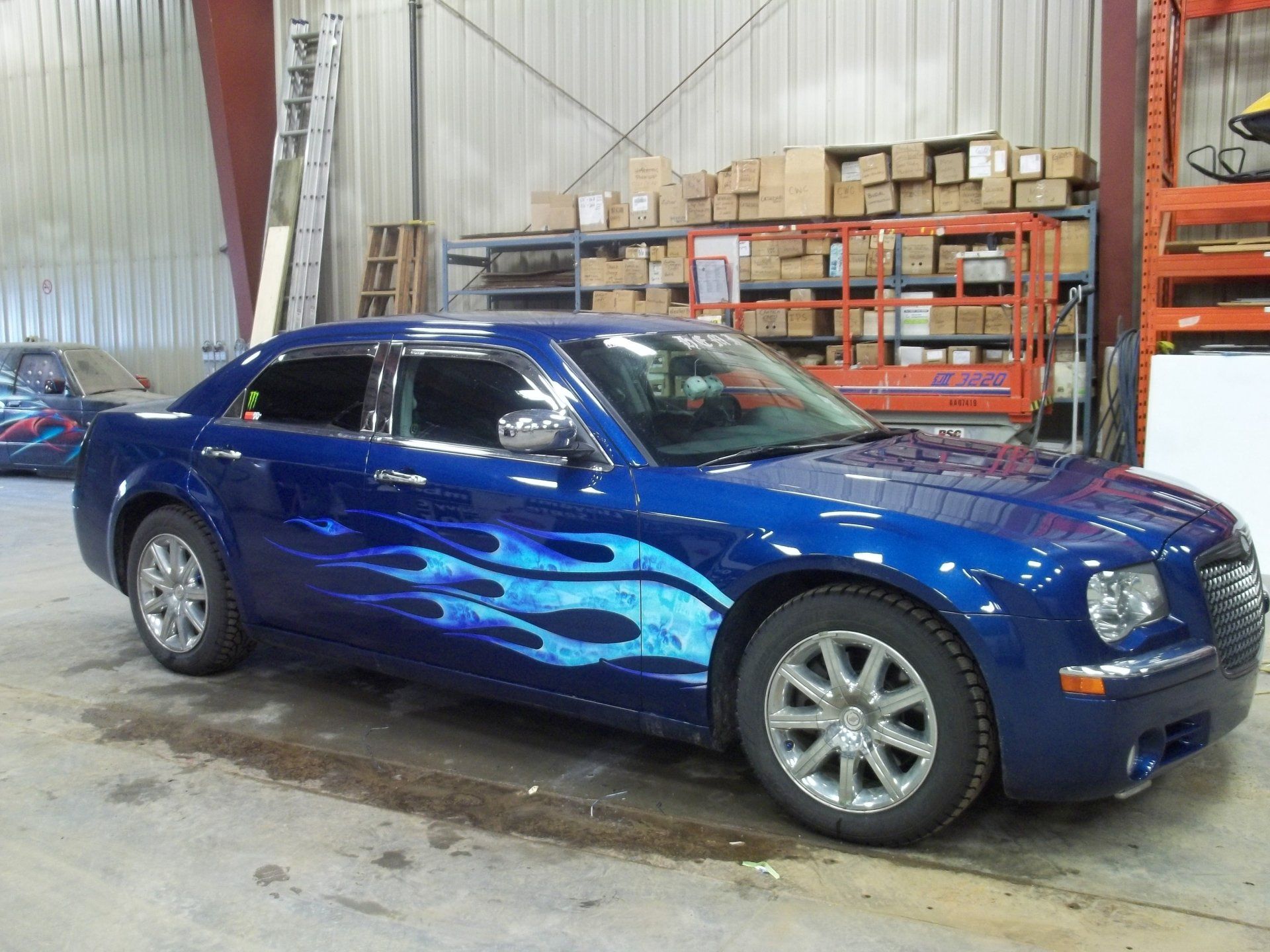 blue luxury car with baby blue flames