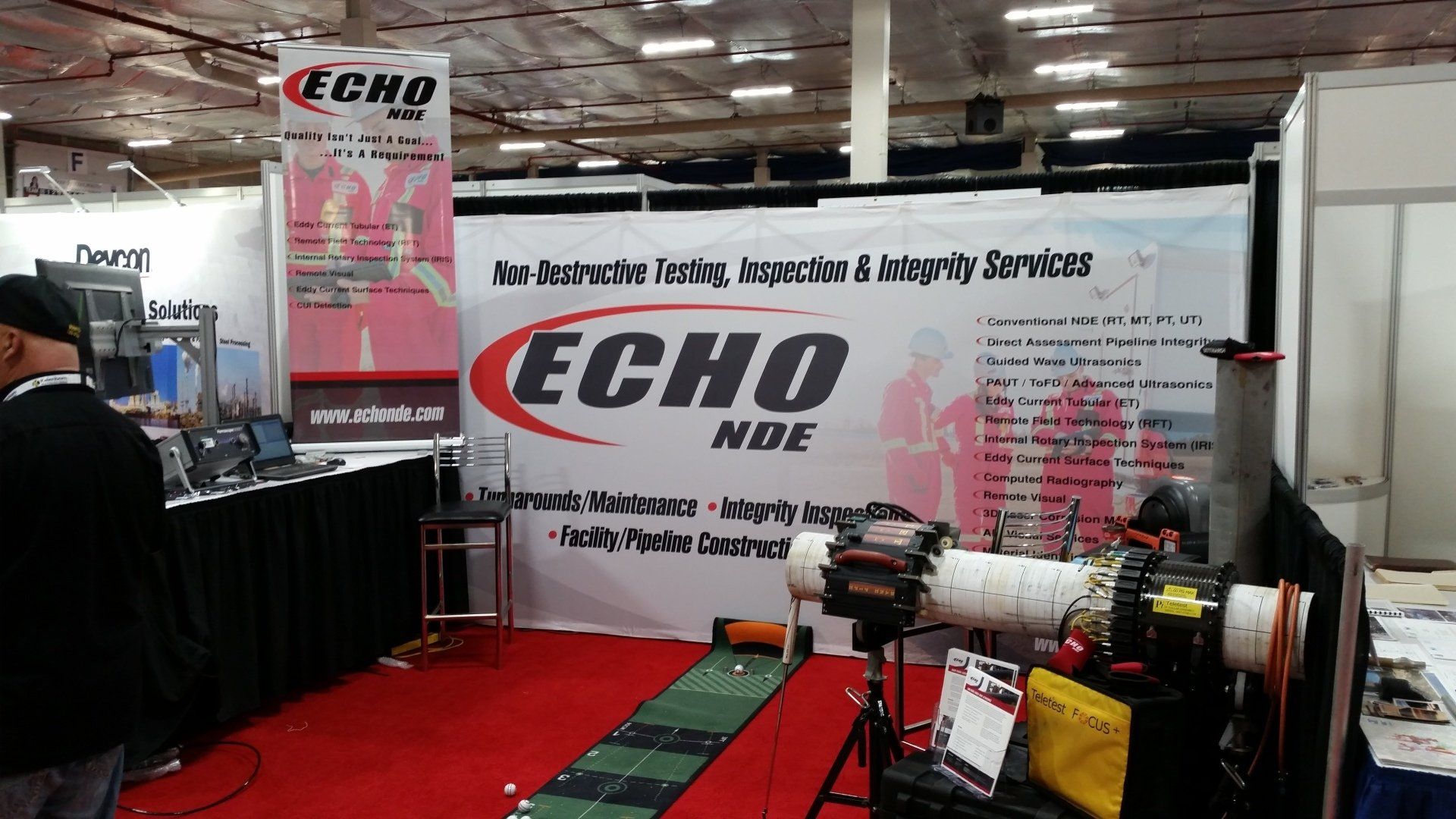 a man is standing in front of a sign that says echo on it .