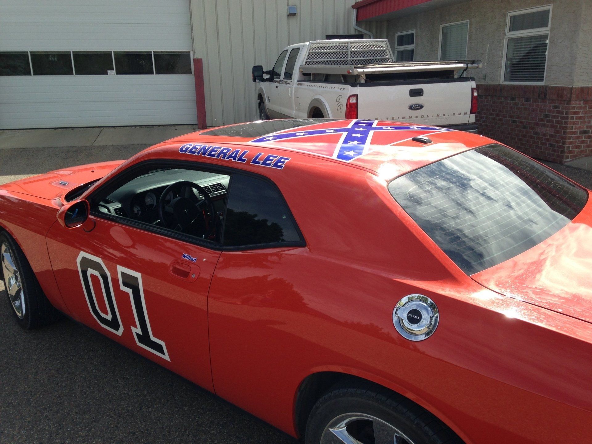 orange muscle care with confederate flag on it