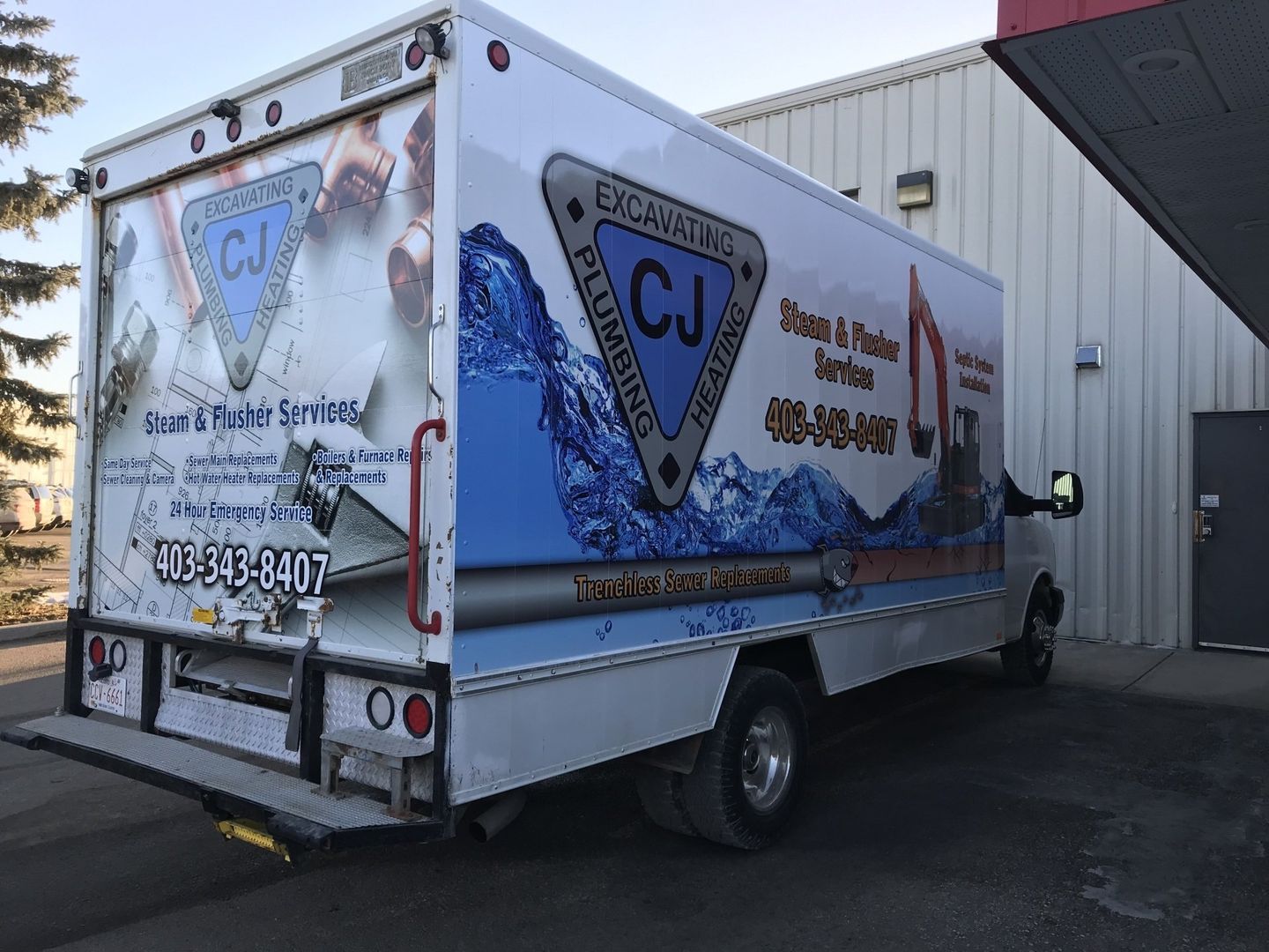 large truck with company logo printed on the side of it
