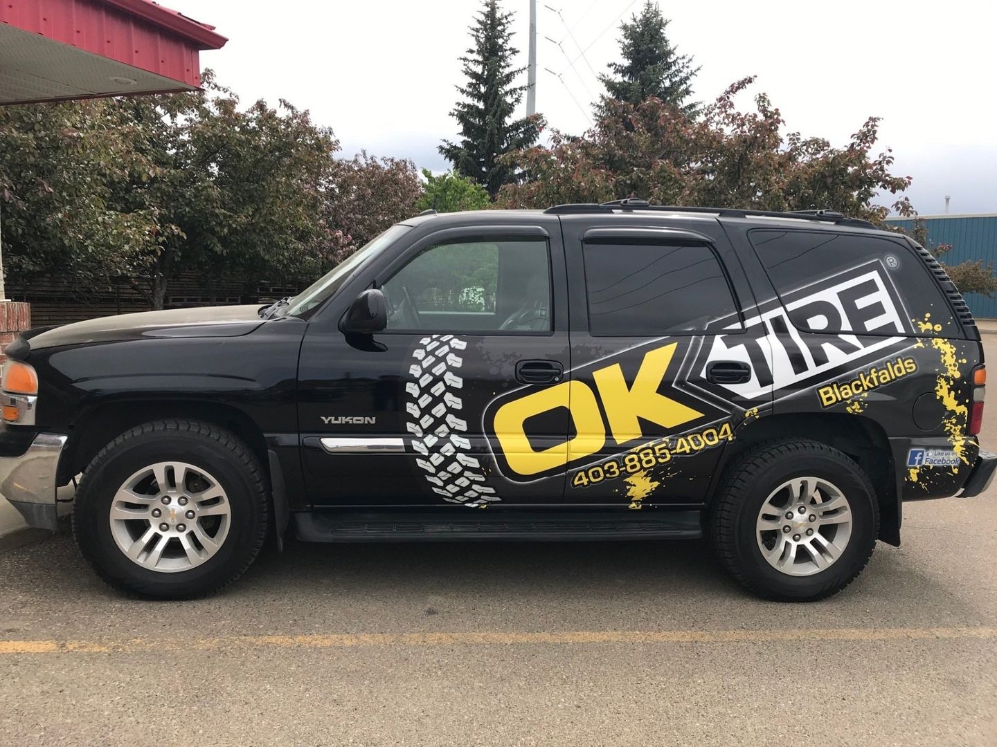 large black suv with company logo on it