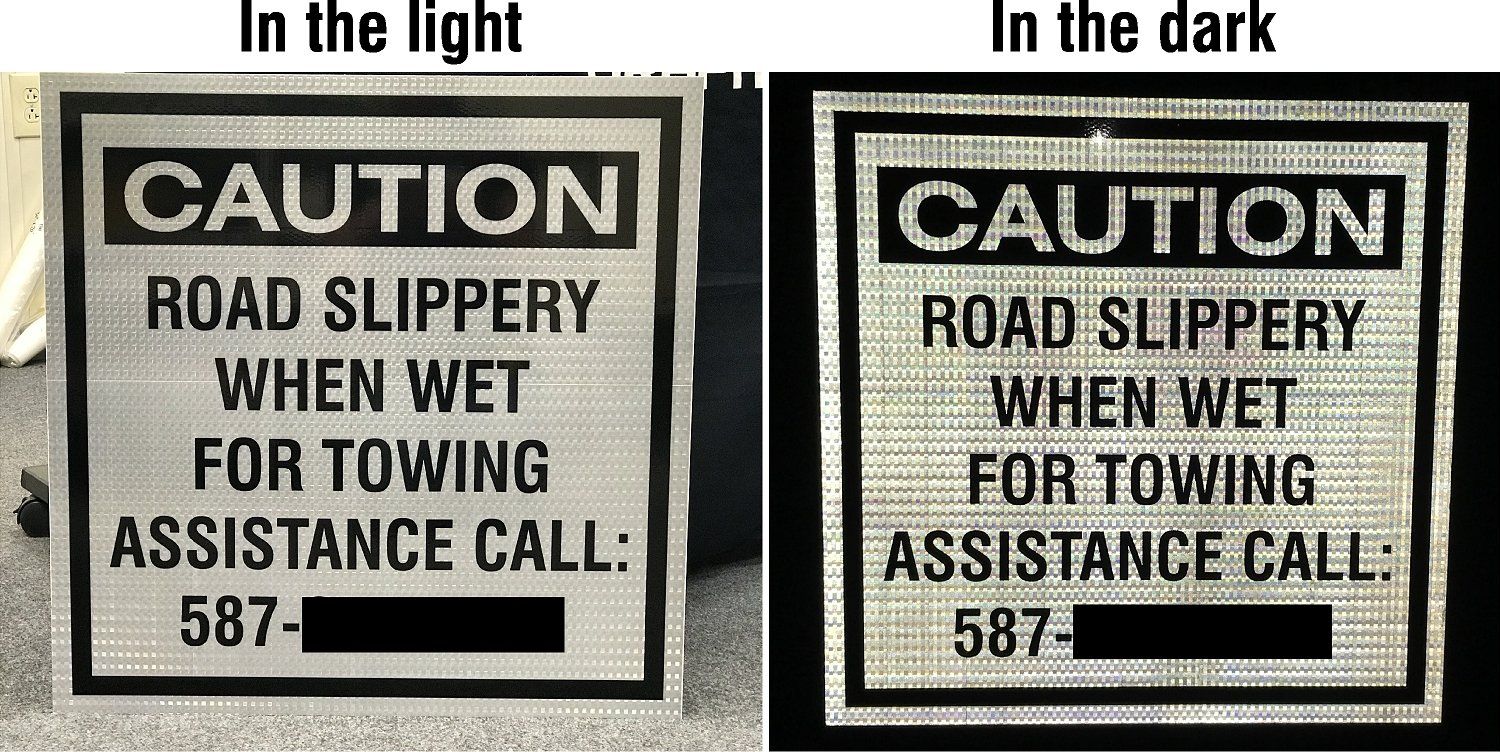 Two white signs with black writing side-by-side