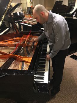 Piano Technician at Work Piano Technician at Work