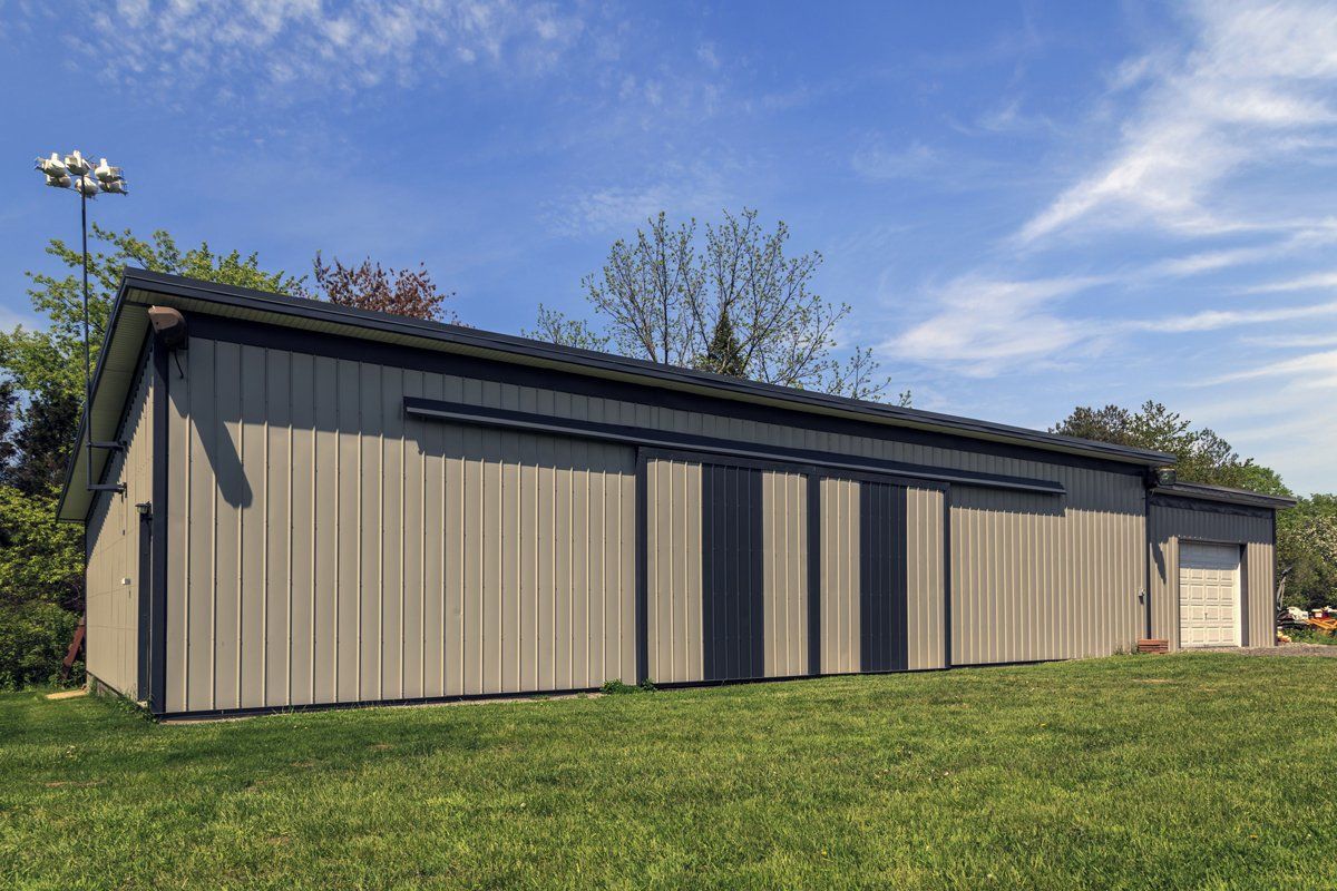 Pole barns with black metal roof
